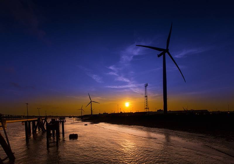 Wind turbines at Port of Tilbury at sunset